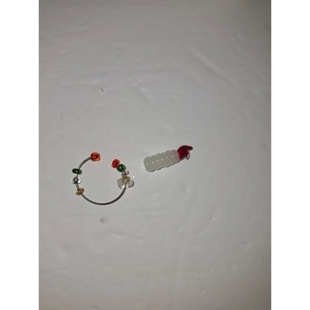 Pier 1 Imports reindeer wine charm‎ set featuring a decorative metal stand